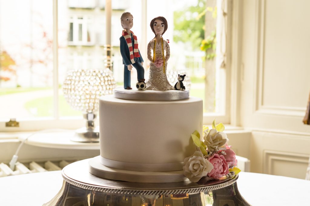 Single tier wedding cake with bespoke topper