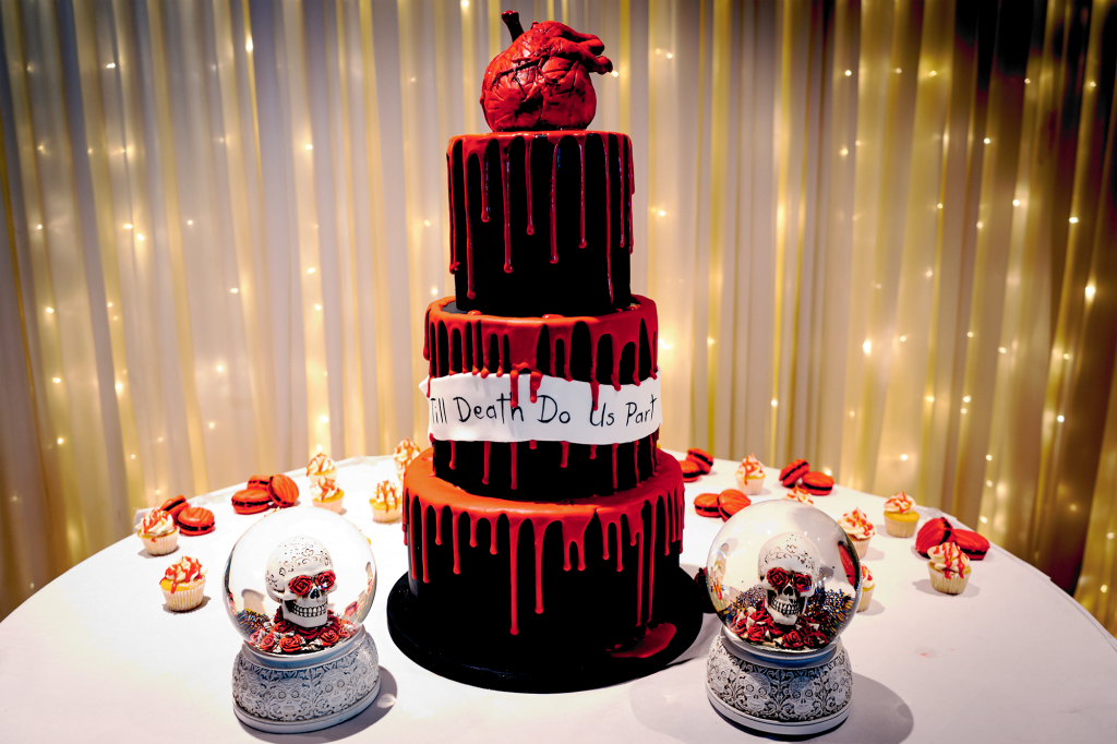 Black and red wedding-cake with heart topper