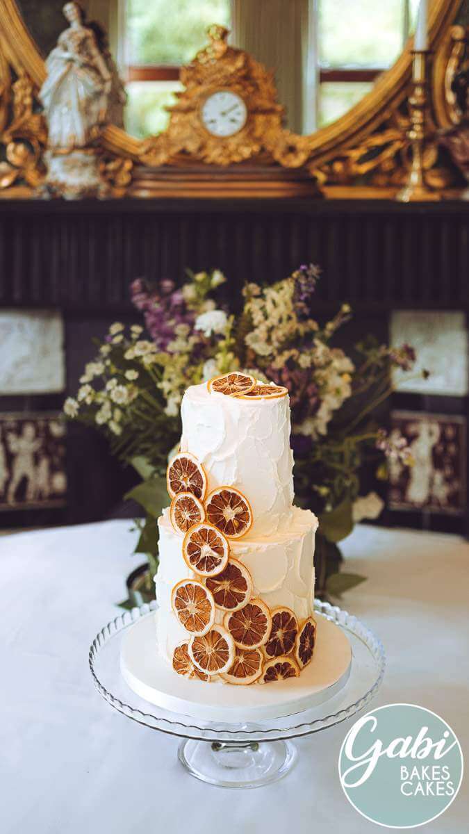 Two tier orange wedding cake.