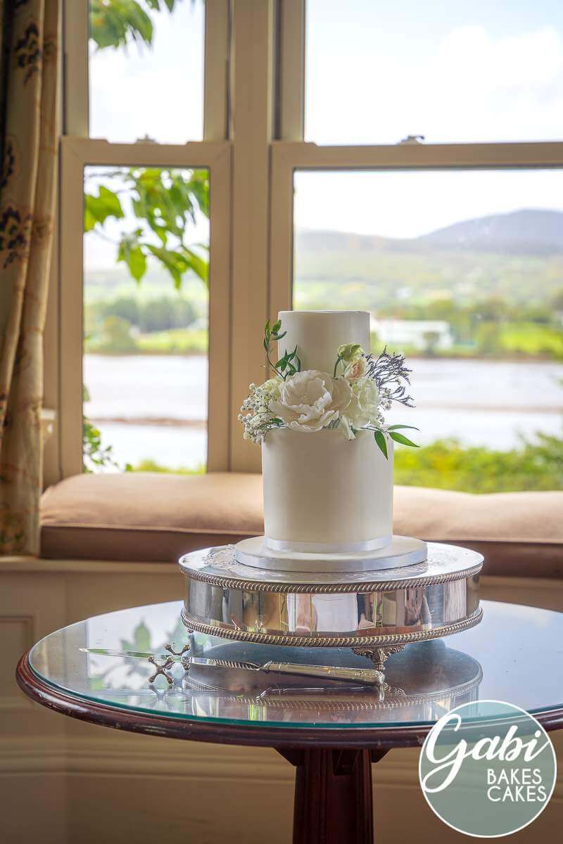 Two tier white classic wedding cake