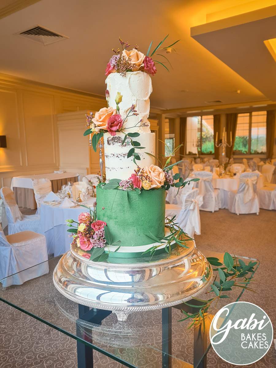 Three tier green and buttercream wedding cake.